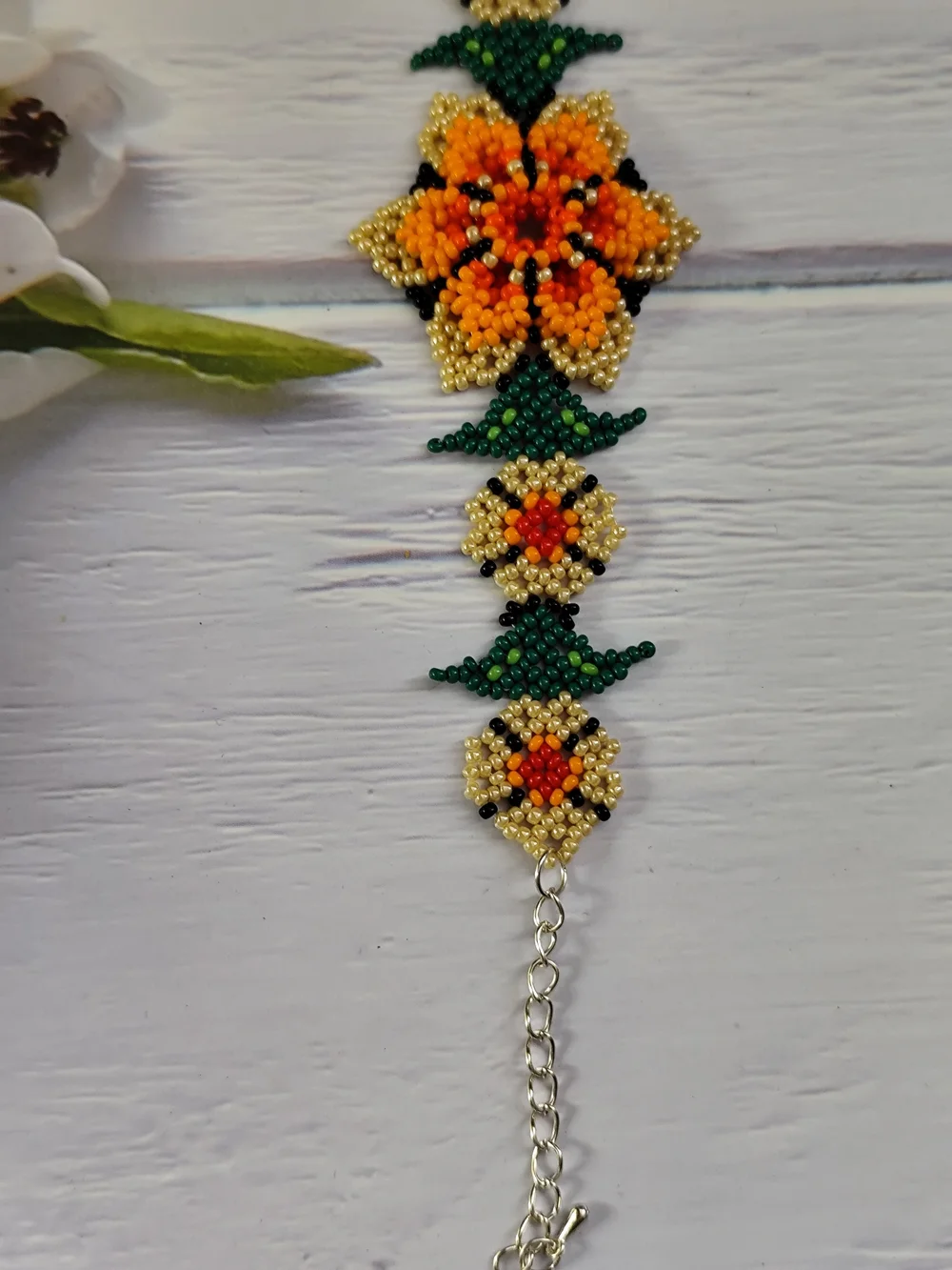 Vibrant Orange Floral Seed Bead Bracelet with Gold & Green Accents